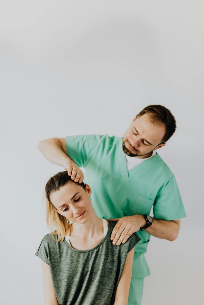 Maximizing Your Blog’s Reach: SEO Tips for Bloggers Positive professional male massage therapist wearing green medical uniform while standing behind positive woman and doing rehabilitation massage on neck muscles against gray background